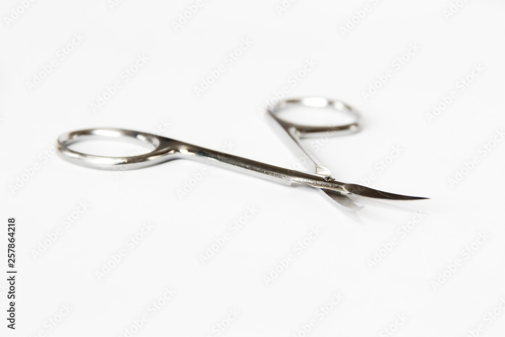 metallic silver manicure sharp scissors on a white background metallic silver manicure sharp scissors on a white background