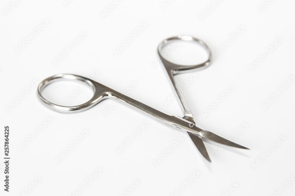 metallic silver manicure sharp scissors on a white background metallic silver manicure sharp scissors on a white background