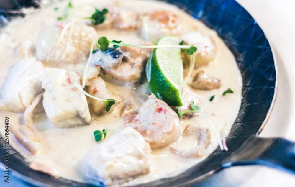 Seafood cream saute with lime in pan in restaurant. Seafood cream saute with lime in pan in restaurant.