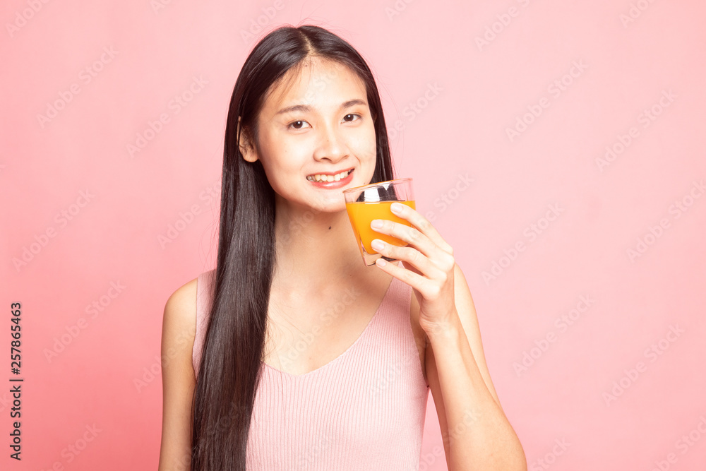 Young Asian woman drink orange juice. Young Asian woman drink orange juice.
