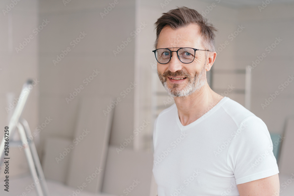 Bearded casual middle-aged man wearing glasses