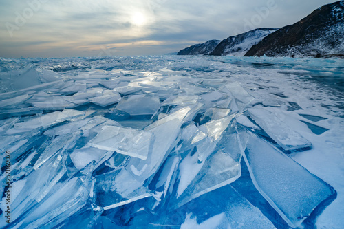 Many cracked blue icicles at Baikal lake