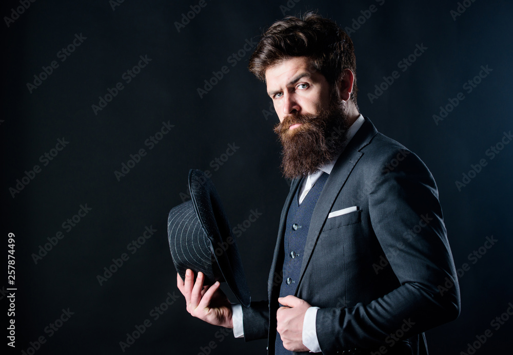 englishman. Businessman in suit. Secret shy. Male formal fashion. brutal  caucasian hipster with moustache. Detective in hat. Mature hipster with  beard. Bearded man gentleman. stylish englishman Stock Photo