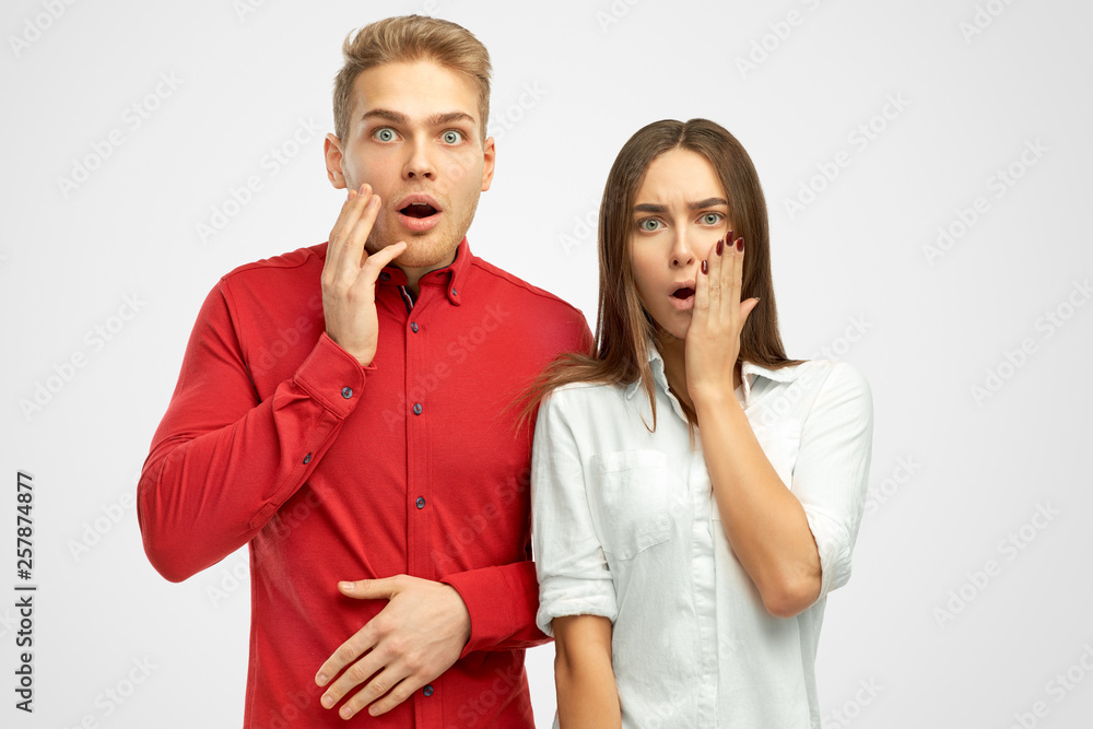 Surprised European people keeps hands on cheeks, shows empathy, amazed by terrible news or revelation, holds hands on face, impressed with something, isolated white background in studio Surprised European people keeps hands on cheeks, shows empathy, amazed by terrible news or revelation, holds hands on face, impressed with something, isolated white background in studio