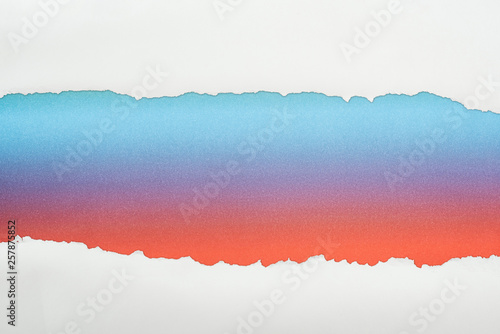 ragged white paper with copy space on multicolored background