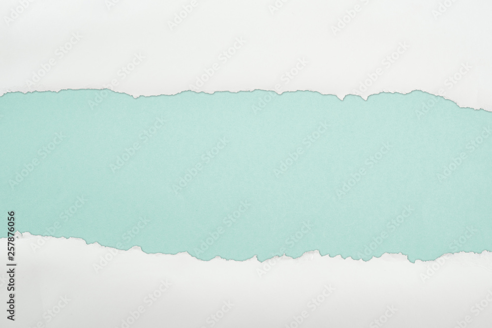 Obraz ragged and white paper with copy space on light blue background