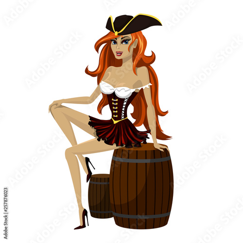 Girl pirate with beautiful long red hair in a pirate hat playfully sits on a wooden barrel.