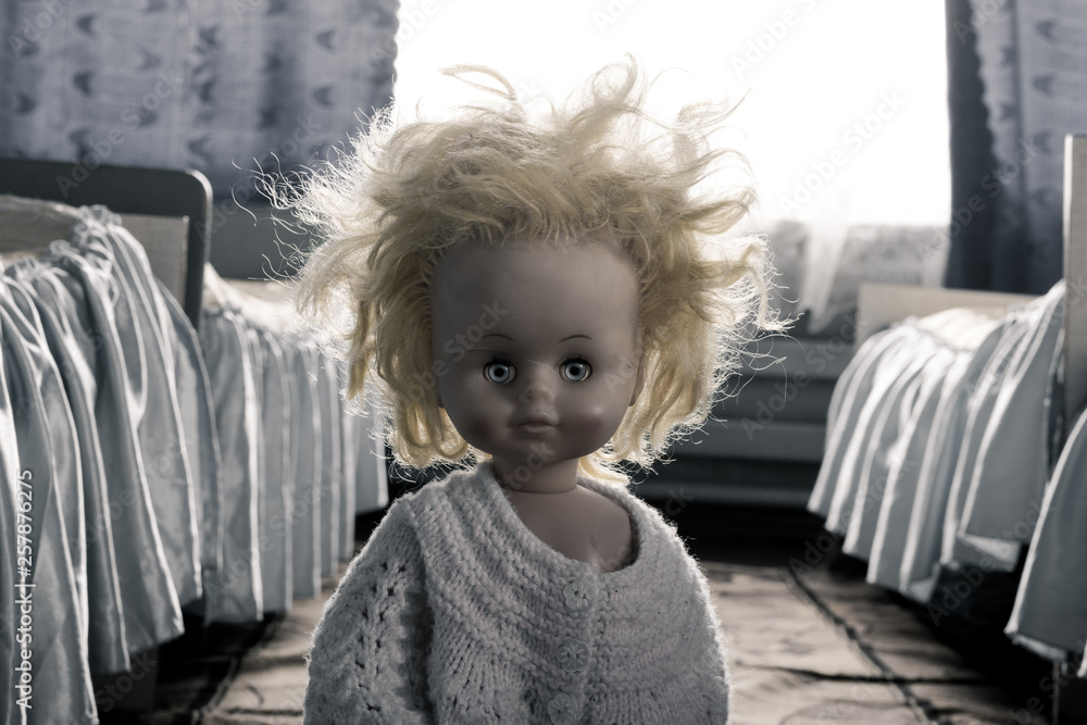 The face of a creepy girl doll with long hair. Doll face closed by hairs  Stock Photo | Adobe Stock