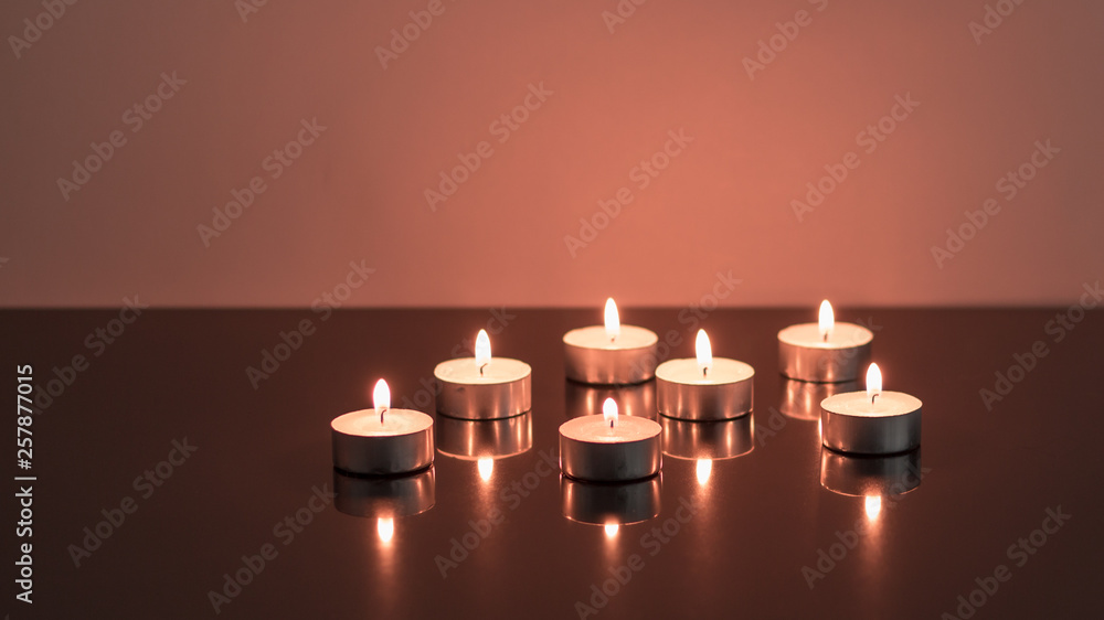 seven burning candles with reflection seven burning candles with reflection