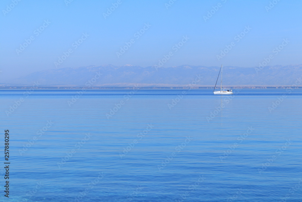 Sailing boat on calm sea