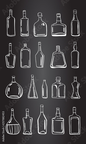 Vector outline hand drawn illustration with different alcohol bottles on blackboard background