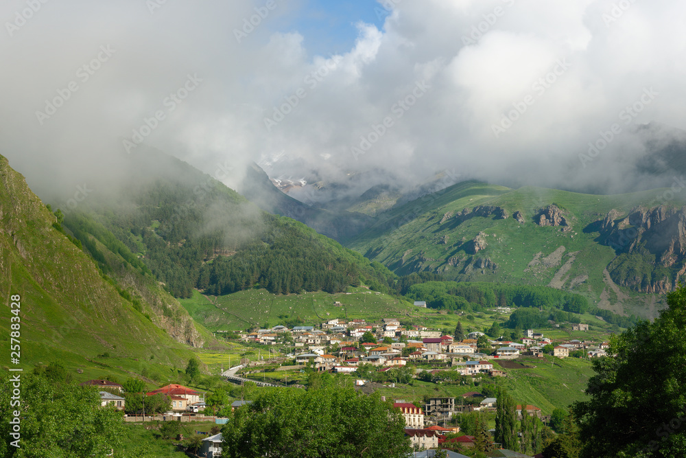 view of the Stepantsminda village in the mountains summer. Georgia