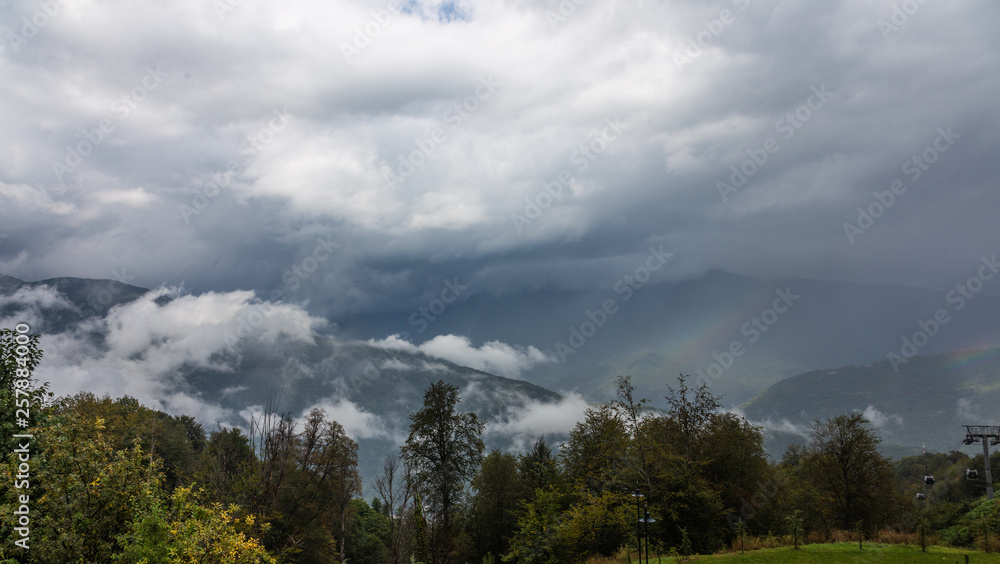 Dramatic sky with thunderclouds and fog over the valley of the river Mzymta, Krasnodar region, Russia Dramatic sky with thunderclouds and fog over the valley of the river Mzymta, Krasnodar region, Russia