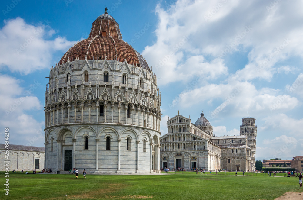 Wide angle view of Romanesque Baptistery of St. John Baptistry at Piazza dei Miracoli Piazza del Duomo popular tourist attraction in Pisa, Italy