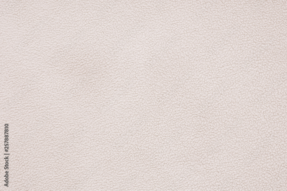 Fototapeta premium Texture of beigesoft material. Background details Terry cloth.