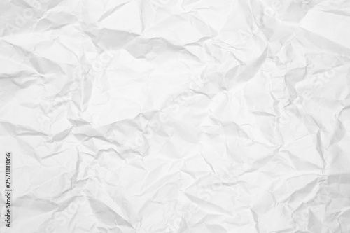 Crumpled white paper texture background. Wrinkled white paper textured background.