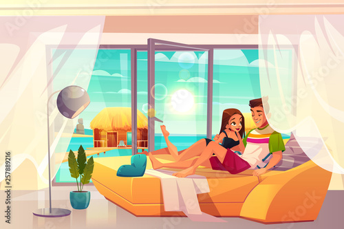 Leisure on luxury resort cartoon vector. Young couple in romantic relationships, lying on bed in comfortable hotel room with seashore landscape outside view illustration. Honeymoon in tropics concept