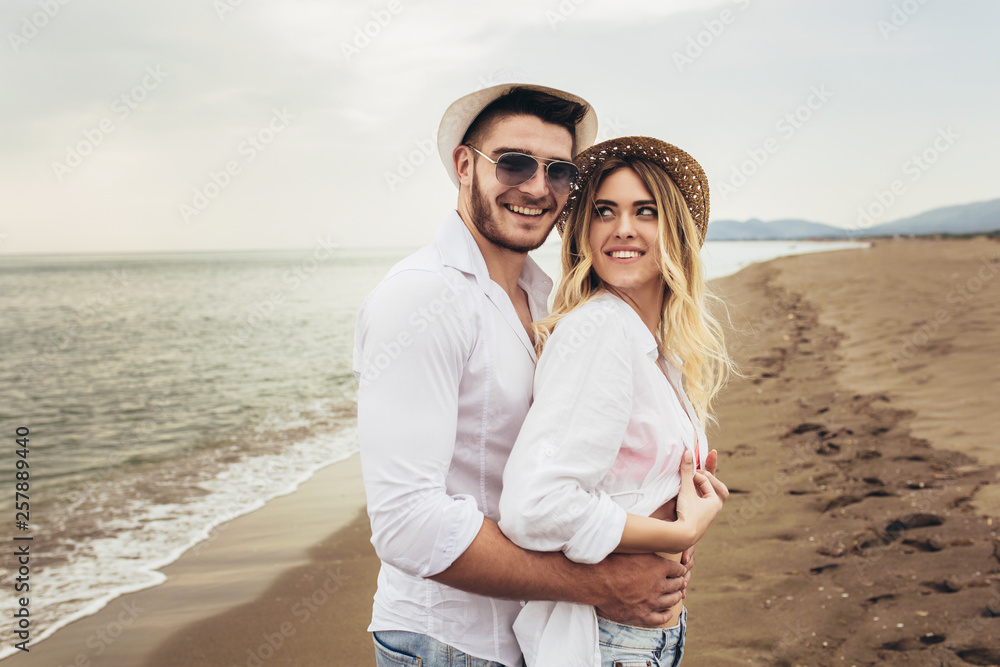 Lovers couple in love having fun dating on beach. Lovers couple in love having fun dating on beach.
