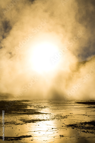 Sunrise behind fumaroles, at an altitude of 4300m over sea level, El Tatio Geysers, Atacama desert, Antofagasta Region, Chile, South America photo