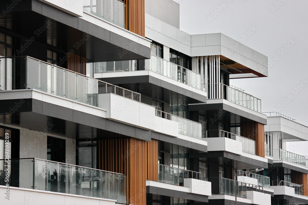 construction of modern residential buildings. the combination of different materials and textures in the design. convenient layout of apartments and houses. low-rise buildings. glass, wood, metal construction of modern residential buildings. the combination of different materials and textures in the design. convenient layout of apartments and houses. low-rise buildings. glass, wood, metal