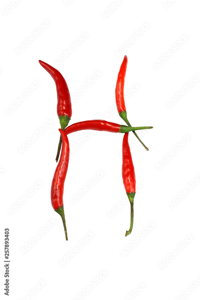 Alphabet of hot spice cayenne chili peppers isolated on white. Vegetable chili peppers in shape of letter M, for making words and logo Alphabet of hot spice cayenne chili peppers isolated on white. Vegetable chili peppers in shape of letter M, for making words and logo