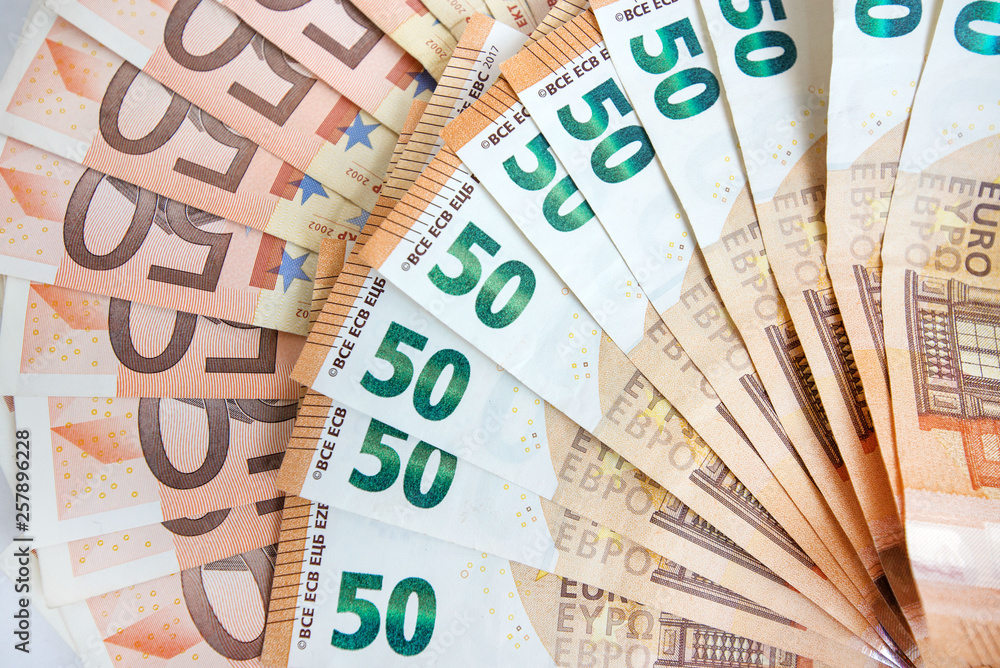 50 euro paper money and coins background. Hundreds of banknotes. Concept of cash flow, finances, rich people, business growth, success and development and millionaire 50 euro paper money and coins background. Hundreds of banknotes. Concept of cash flow, finances, rich people, business growth, success and development and millionaire