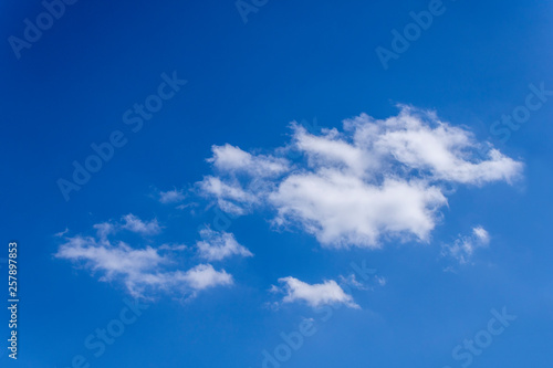 The vast blue sky background. White clouds on sky.