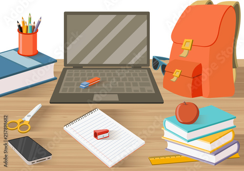 Student table with books and other objects. 