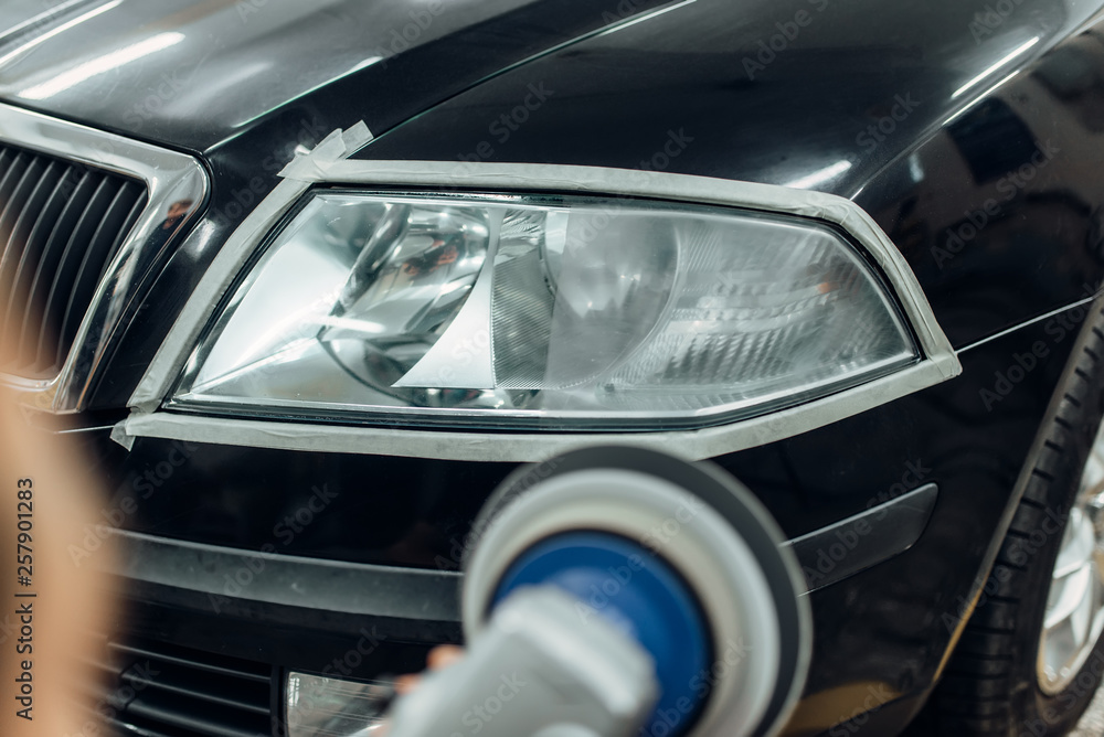 Detailing of car headlights with polishing machine
