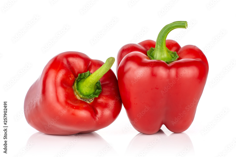 Group of two whole bulgarian red bell pepper isolated on white background Group of two whole bulgarian red bell pepper isolated on white background