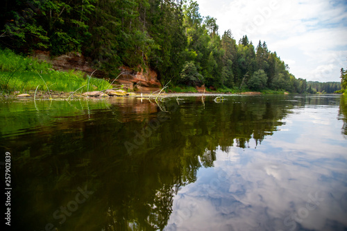 Landscape with river, cliff and forest in Latvia.