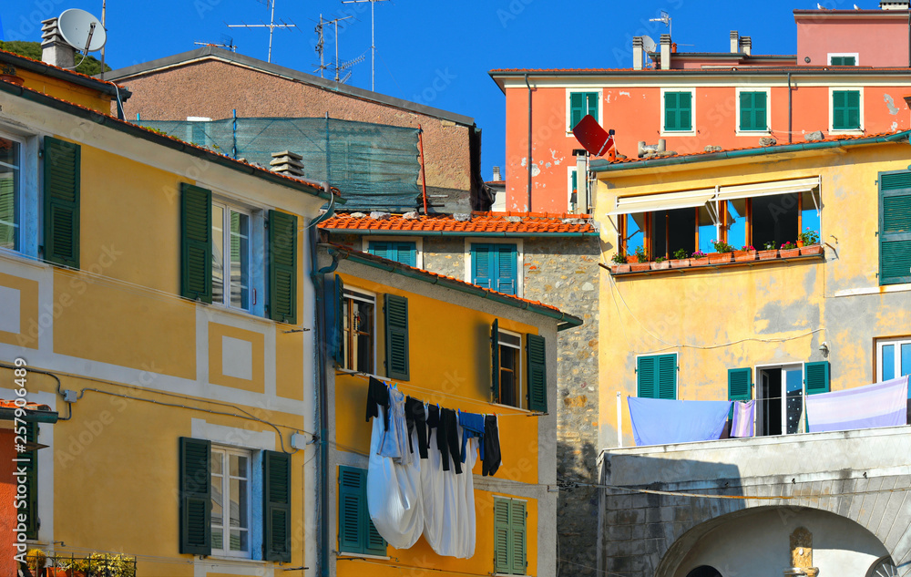 Picturesque corner with colorful houses and old facade in background in small fishermans village Tellaro in liguria, italy