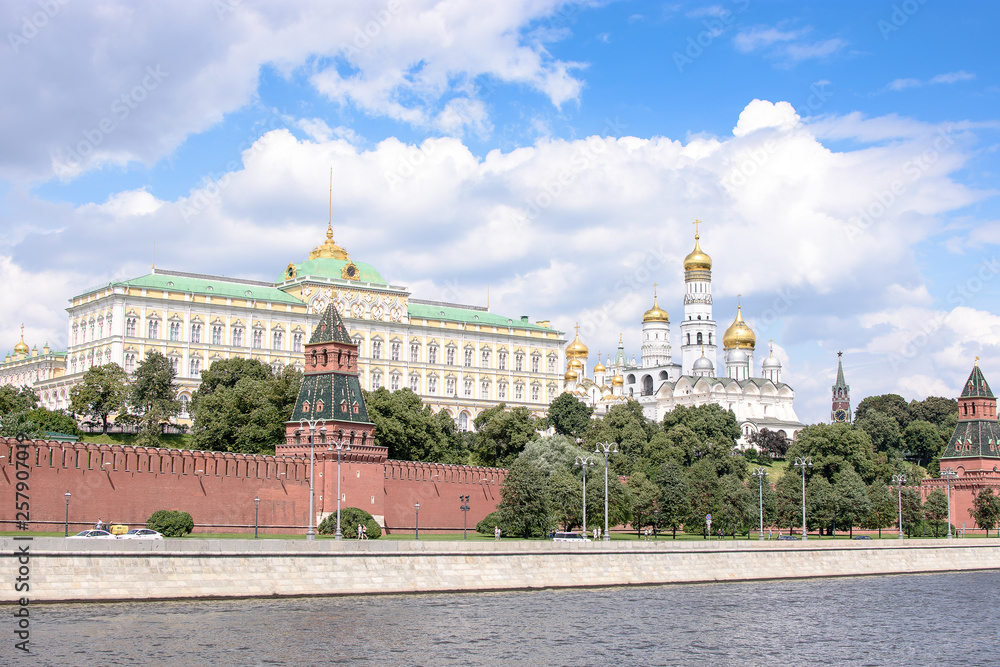 RUSSIA, MOSCOW - June 30, 2017:View of the Kremlin across the river, temples with golden domes RUSSIA, MOSCOW - June 30, 2017:View of the Kremlin across the river, temples with golden domes