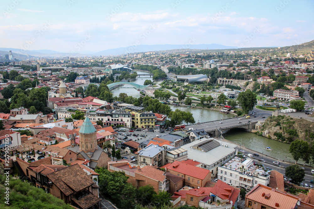 View of the city from the observation deck. The capital of Georgia is Tbilisi. Old city. The Kura River. Red roofs, low buildings. Panorama, architecture, urban