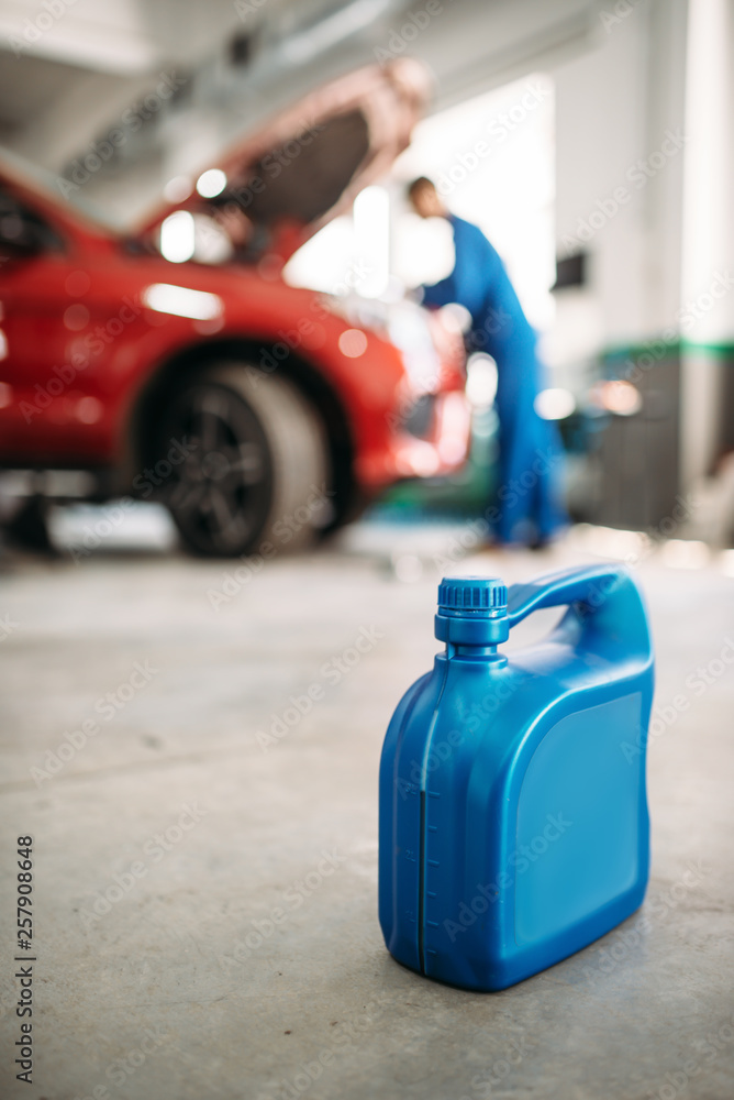 Oil canister on the floor in car service Oil canister on the floor in car service