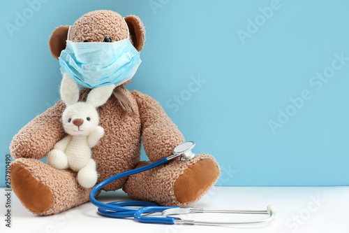 Toys with stethoscope on table