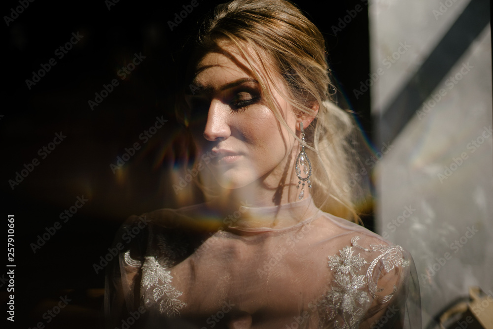 Bride in white wedding dress posing indoors Bride in white wedding dress posing indoors