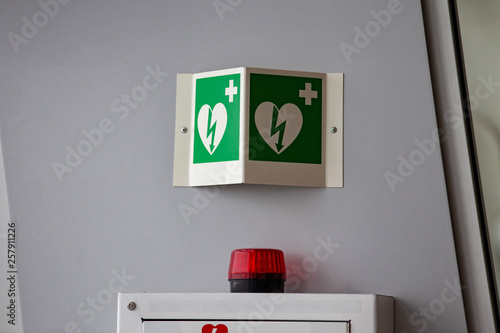 defibrillator attached to the wall at the airport