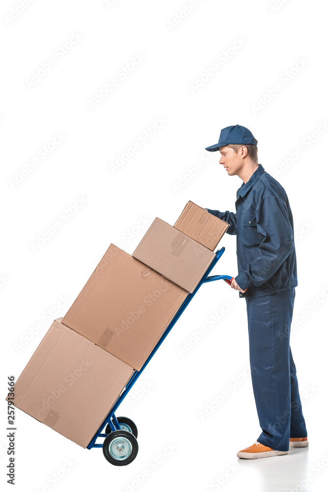 mover in uniform transporting cardboard boxes on hand truck isolated on white with copy space mover in uniform transporting cardboard boxes on hand truck isolated on white with copy space