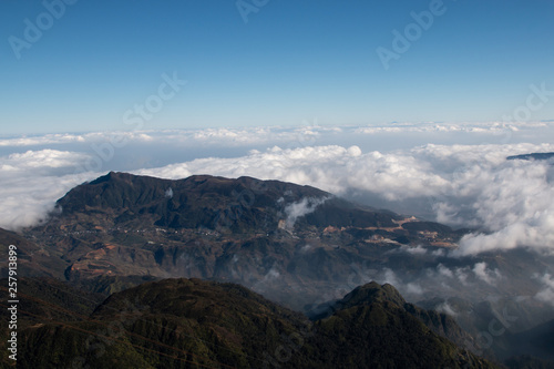 amazing landscape view of nature scene with fog and mist at fansipan vietnam mountain .