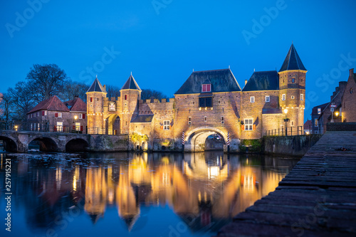 Medieval city gate as entrance over a flowing river; eem, in Amersfoort holland