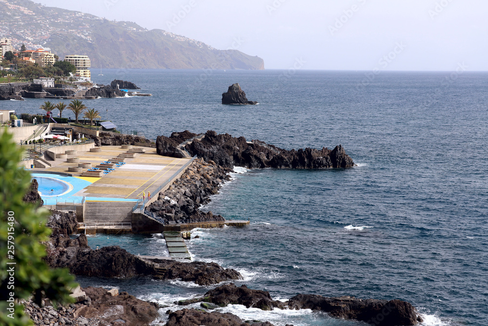 Side view of the coast of the island of Madeira. Background, cropped shot, horizontal, free space for text. Concept of nature and recreation.