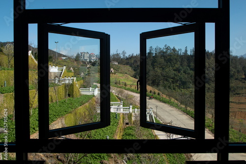 view on the way to Fansipan mountain in Sapa Vietnam . frame of window and national garden .