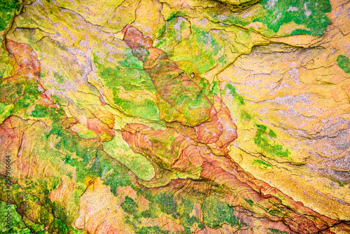 Colourful sedimentary rocks formed by the accumulation of sediments – natural rock layers backgrounds, patterns and textures - abstract graphic design – geology – nature formations