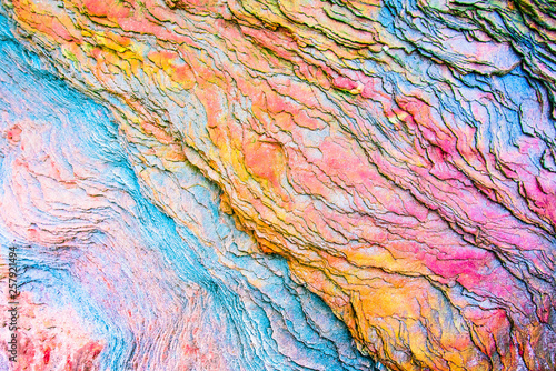 Colourful sedimentary rocks formed by the accumulation of sediments – natural rock layers backgrounds, patterns and textures - abstract graphic design – geology – nature formations photo