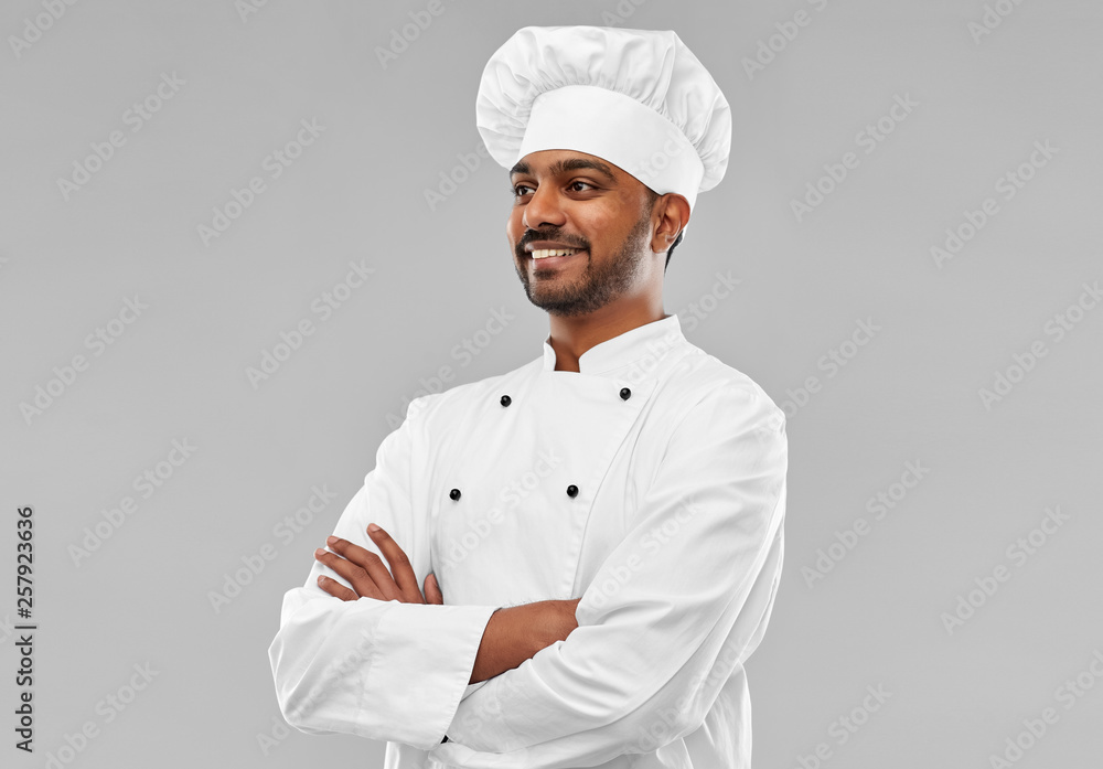 cooking, profession and people concept - happy male indian chef in toque over grey background cooking, profession and people concept - happy male indian chef in toque over grey background