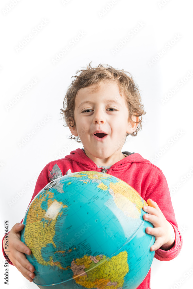 Child holding a globe in his arms. Child holding a globe in his arms.