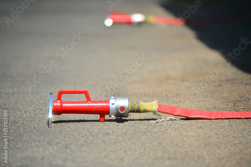 fire hose on the floor use to make water barrier from heat wave of fire