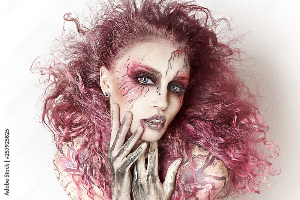 Close up portrait of sexy beautiful witch with Halloween makeup. Beautiful  flying pink hair. Professional creative face painting Stock Photo | Adobe  Stock