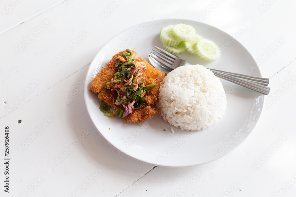 Fried fish spicy salad served with rice